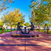 Show Low Founders Bronze Card Player Statue and Festival Marketplace Park